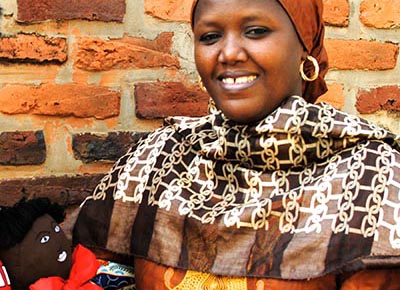 Rwandan woman with a doll from Dolls for Dads