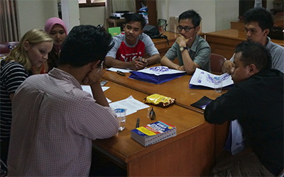 A group of young men and women Generasi Jagoan participants watch the campaign video in Indonesia.