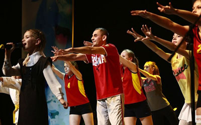 Children perform on stage for Russia's "World's Greatest Father" competition.