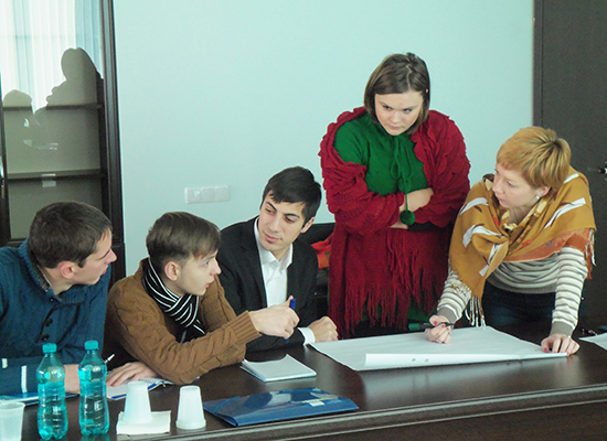 Participants have a discussion at a workshop on domestic violence prevention in Moldova