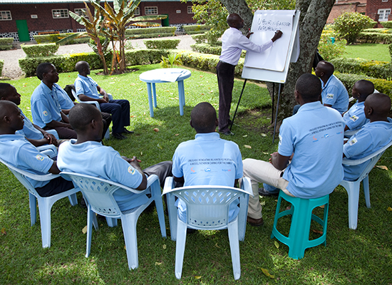 Men participate in a MenCare+ fathers' group session in Rwanda.