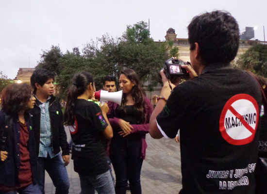 Youth in Lima participate in a street performance as part of the "Anti-Machismo Brigade."