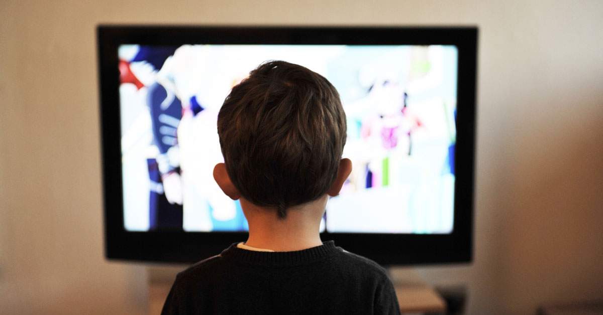 A child watches TV.