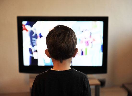 A child watches TV.